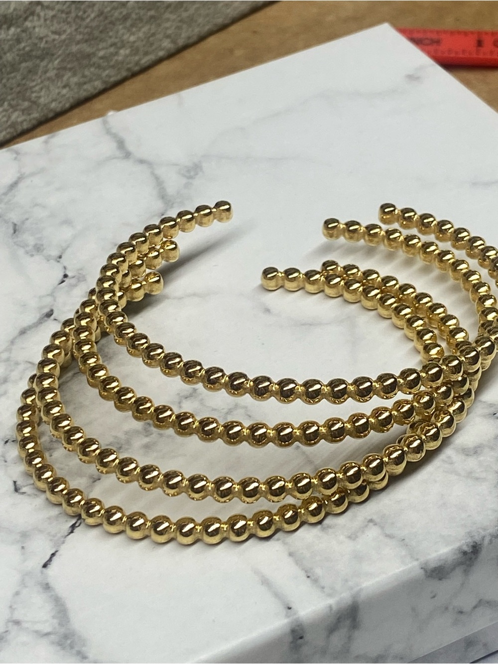 Four Gold Beaded cuff bracelets